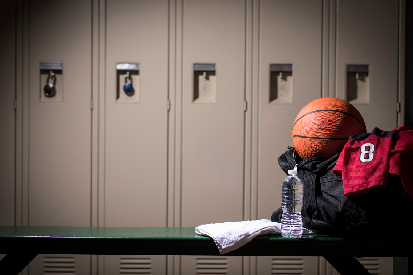 Basketball sports equipment in school gymnasium locker room.